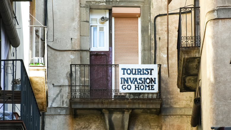 apartment balcony with protest sign