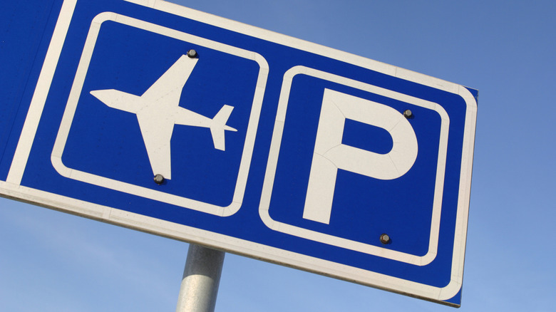 Blue and white airport parking sign