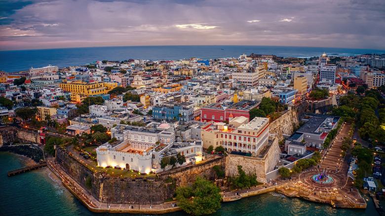 Aerial view of colorful buildings and stone wall in Old San Juan