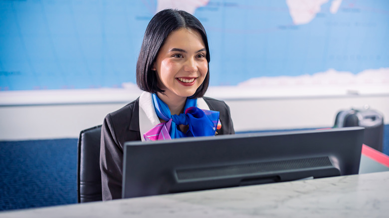 airline staff at check-in counter