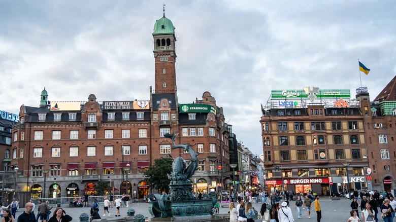 Stroget, Copenhagen square with pedestrians walking.