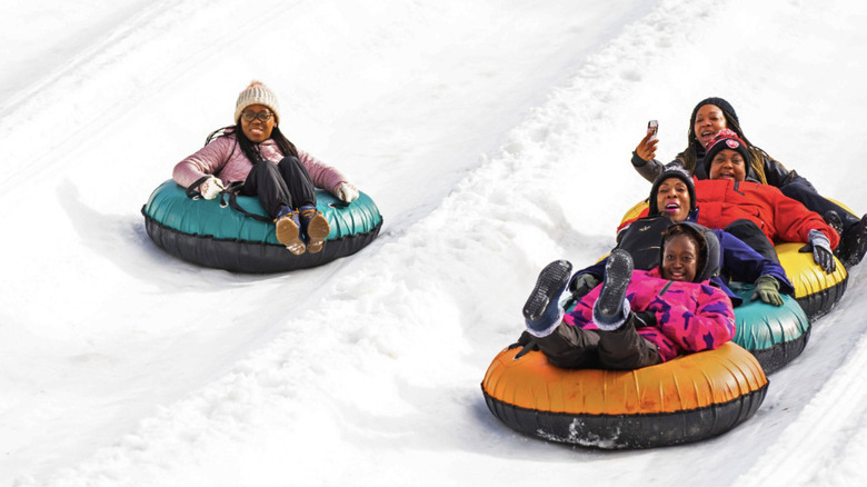 A family goes snow tubing at Massanutten Resort.