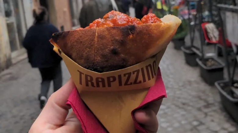 Trapizzino held in hand