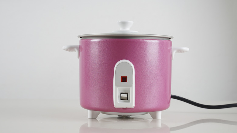 Pink ricecooker on a countertop