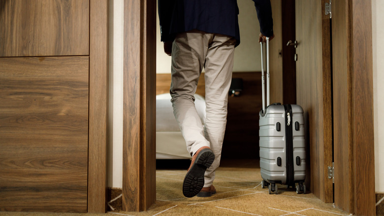 Traveler leaving hotel room