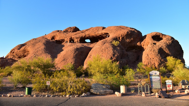 red rock formation with hole