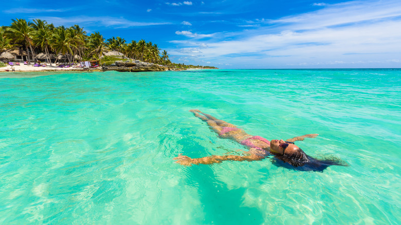 Woman floating in Caribbean Sea
