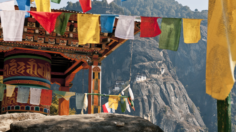 Prayer flags and temple in Bhutan mountains