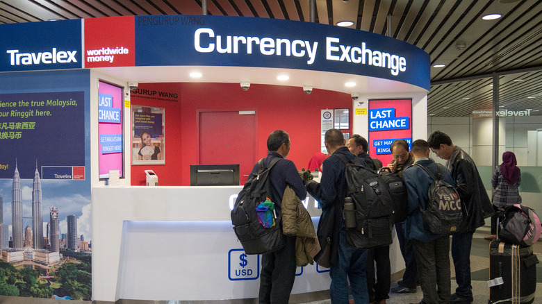 People at airport currency exchange