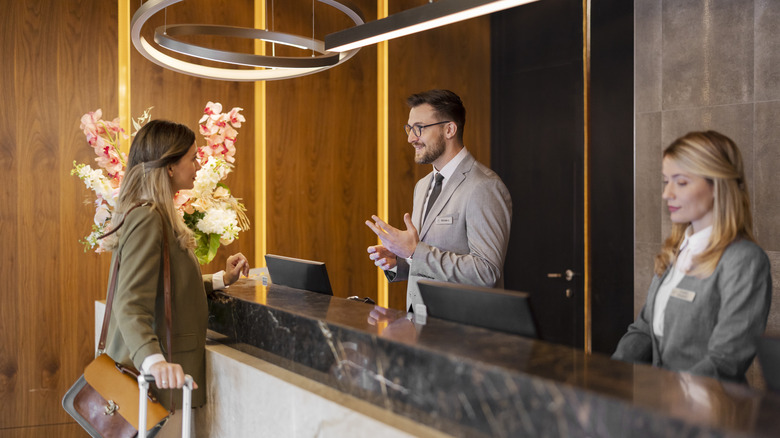 Woman at hotel desk