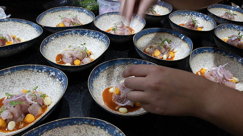 Chef preparing ceviche dishes