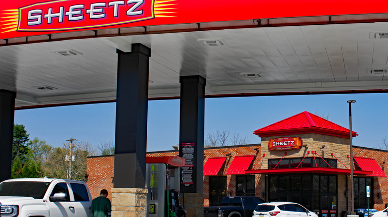 Patrons fill their tanks in front of a Sheetz