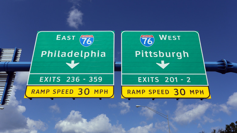 Highway signs point to Philadelphia and Pittsburgh