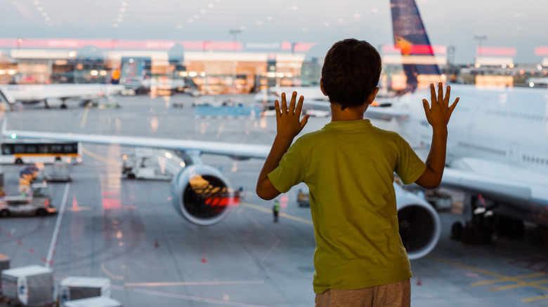 child watching planes