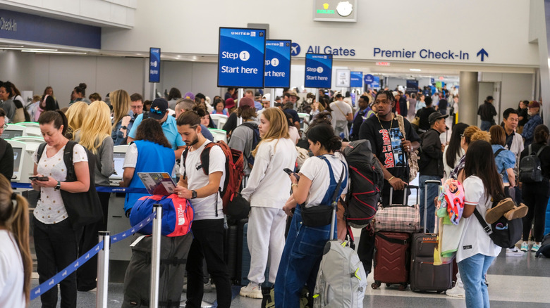 Very busy check-in queue at airport