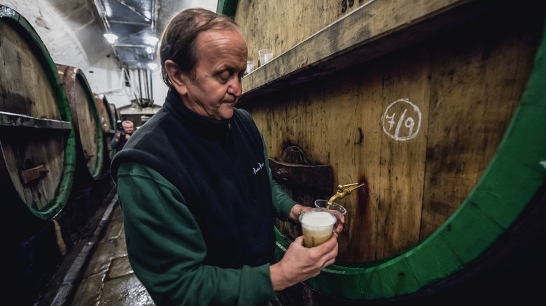 Pouring beer Pilsner Urquell brewery