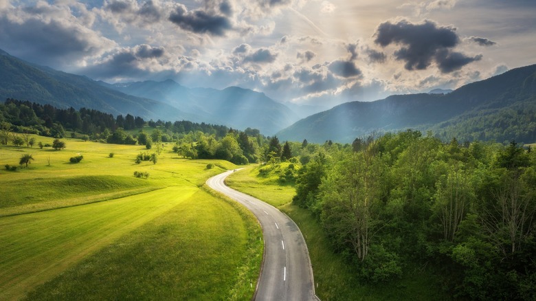 light-filled road in mountain valley