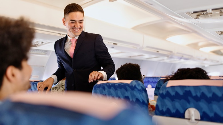 Flight attendant smiling at a passenger