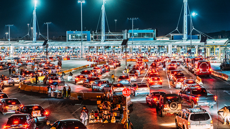 cars wait at U.S. Mexico border