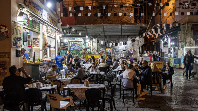 people dining outside at Vucciria Market, nighttime