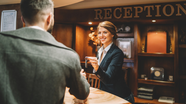 Man receiving hotel key