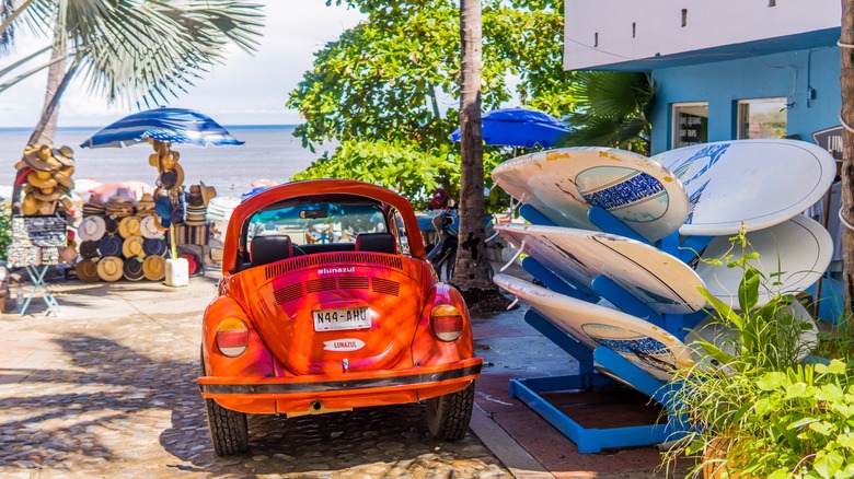 Red car with surf boards