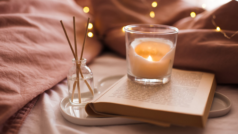 Book with candle burning
