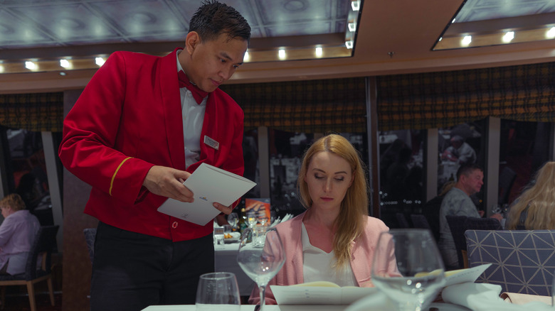 Woman ordering food on cruise ship