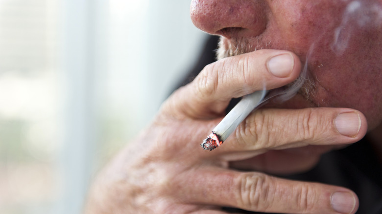 person smoking cigarette