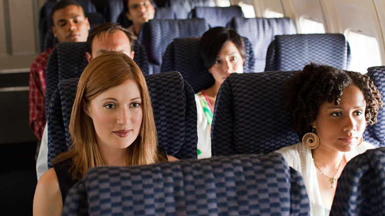 diverse plane passengers