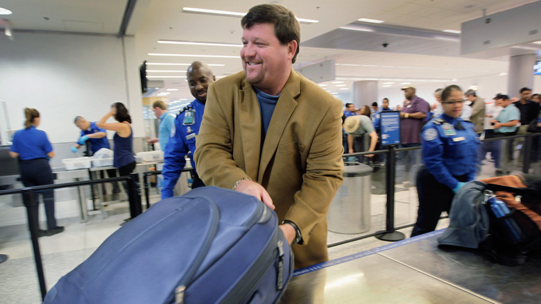 Happy traveler at airport security