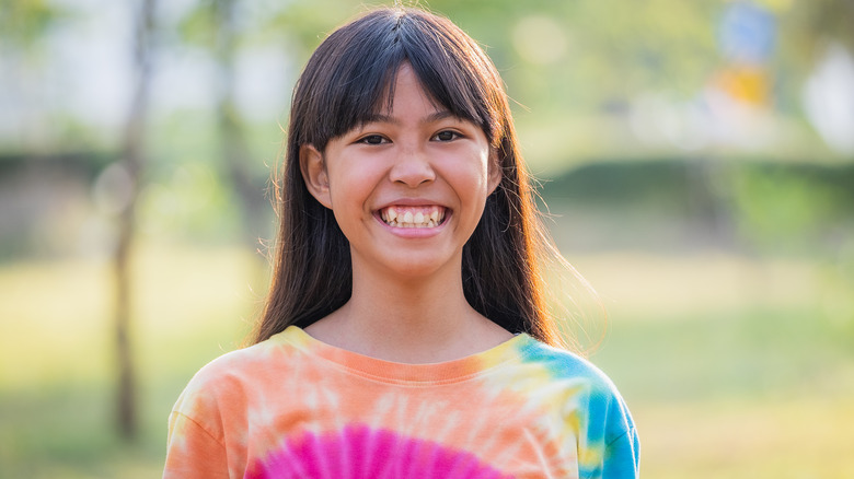 girl in tie-dye shirt