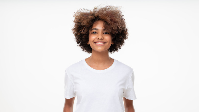 smiling person with white shirt