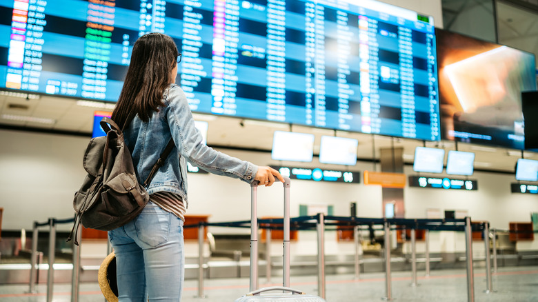 Woman in jeans at airport