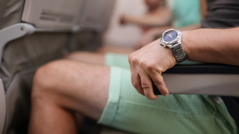 Person wearing shorts on plane