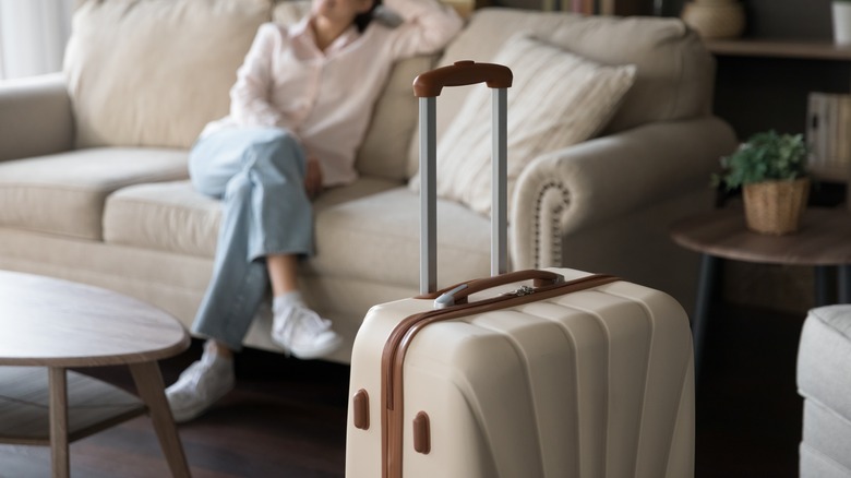 person's suitcase in living room