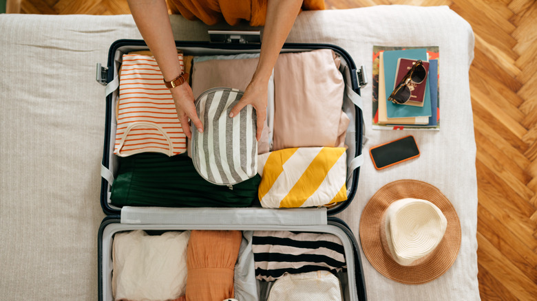 A woman packing her suitcase 