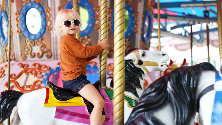 A child on a carousel ride
