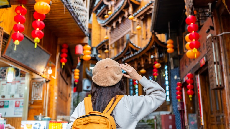 Woman walking through Furong town