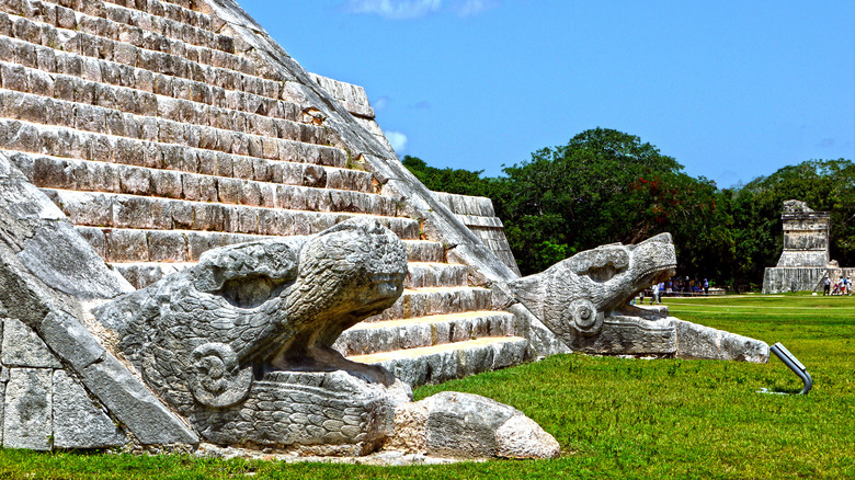 Snake sculptures along a staircase