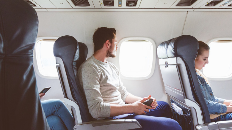 Man sitting on airplane