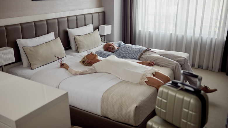 Couple smiling in hotel room