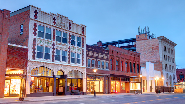 illuminated city street at dusk