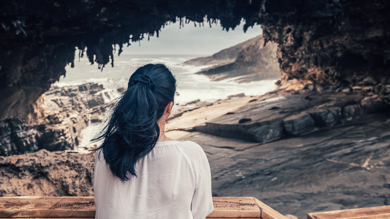 Woman admiring Admiral's Arch formation