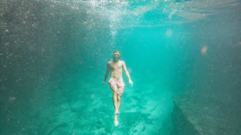 snorkeler under clear water