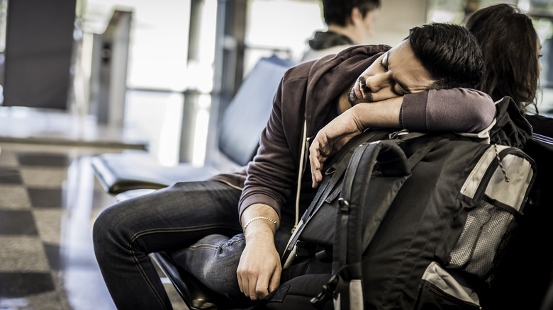 Man sleeping at airport