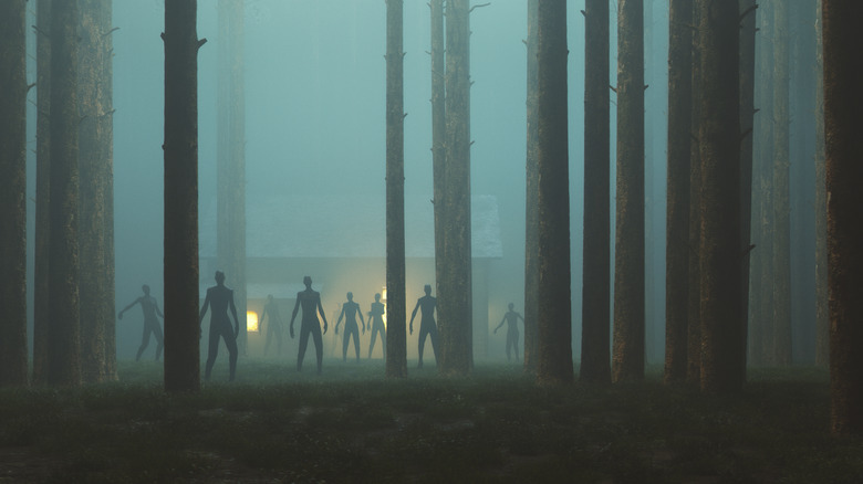 Zombie in foggy forrest distance