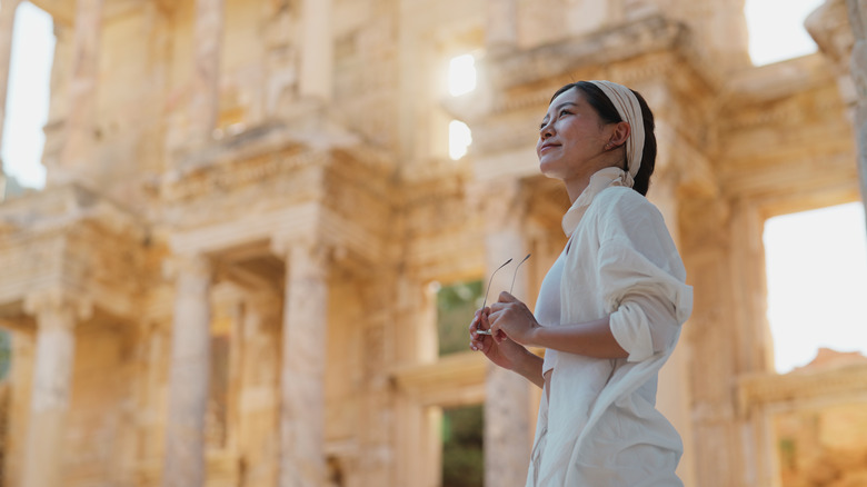 Woman touring ancient ruins