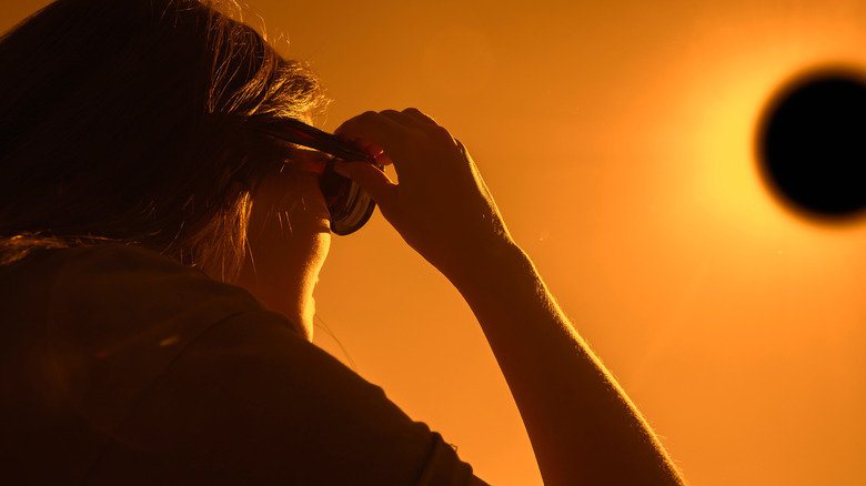 woman watching eclipse