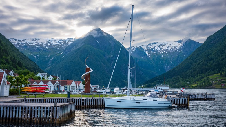 boat at dock with mountains